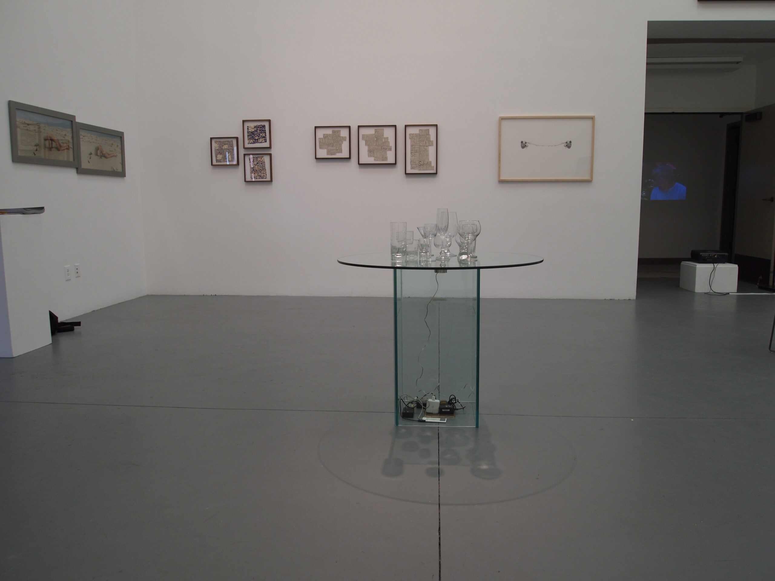 A table made of glass kept at the center of a table